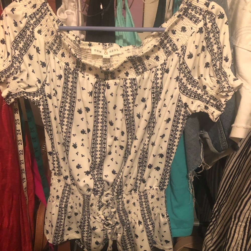 Blue and white top, sleeves slightly off shoulder